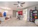 Bonus room with an exercise bike, ceiling fan, and doorway leading to a sitting room at 47 Strada Principale, Henderson, NV 89011