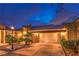 Charming stucco home with tile roof features a paved driveway and manicured landscaping at 47 Strada Principale, Henderson, NV 89011