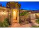 Inviting front entrance features stucco exterior, stone accents, manicured landscaping and covered entry at 47 Strada Principale, Henderson, NV 89011