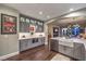 Spacious kitchen with stainless steel appliances, an open floor plan, and dark hardwood floors at 47 Strada Principale, Henderson, NV 89011