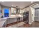 Stylish kitchen featuring white cabinets, subway tile backsplash, and stainless steel appliances at 47 Strada Principale, Henderson, NV 89011