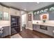 Modern kitchen featuring white cabinets, stainless steel appliances, and access to other rooms at 47 Strada Principale, Henderson, NV 89011