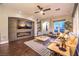 Cozy living room features a modern fireplace, stylish decor, and scenic views through large windows at 47 Strada Principale, Henderson, NV 89011
