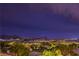 Scenic nighttime view overlooking the city, set against a backdrop of majestic mountains at 47 Strada Principale, Henderson, NV 89011