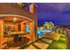 Outdoor living space with seating area, pool, spa, and scenic views for perfect relaxation at 47 Strada Principale, Henderson, NV 89011