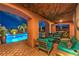Inviting outdoor living space featuring a pool, lounge area, and scenic views for relaxation at 47 Strada Principale, Henderson, NV 89011