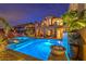 Captivating backyard pool and spa with water feature and covered balconies offer a relaxing outdoor experience at 47 Strada Principale, Henderson, NV 89011