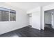 Bright bedroom featuring dark floors, a window, and a closet with sliding doors at 4981 Alondra Dr, Las Vegas, NV 89118