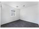 Modern bedroom with gray flooring, a large window, and ample natural light at 4981 Alondra Dr, Las Vegas, NV 89118