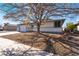 Cozy single-story home featuring xeriscape, mature tree providing shade, and an attached two car garage at 4981 Alondra Dr, Las Vegas, NV 89118
