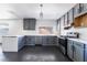 Stylish kitchen boasting sleek gray cabinetry, stainless steel appliances, and bright countertops at 4981 Alondra Dr, Las Vegas, NV 89118