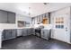 Updated kitchen features gray cabinets, stainless steel appliances, and durable white countertops for a modern look at 4981 Alondra Dr, Las Vegas, NV 89118
