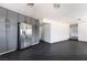 Open kitchen area with gray cabinets and stainless steel fridge providing ample space for cooking and entertaining at 4981 Alondra Dr, Las Vegas, NV 89118