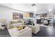 This light and bright living room features an open floor plan with the kitchen and luxury vinyl plank flooring at 4981 Alondra Dr, Las Vegas, NV 89118