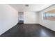 Light-filled room with luxury vinyl plank flooring and white walls, offering versatility for various decor styles at 4981 Alondra Dr, Las Vegas, NV 89118