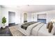 Staged main bedroom with luxury vinyl plank flooring, ample closet space, and decorative built in cabinets at 4981 Alondra Dr, Las Vegas, NV 89118