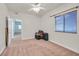 Spacious bedroom with carpet, a window, and an open doorway at 5250 S Rainbow Blvd # 1144, Las Vegas, NV 89118