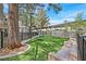 Community dog park featuring artificial turf, agility equipment, and benches for pet owners at 5250 S Rainbow Blvd # 1144, Las Vegas, NV 89118