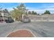 Complex with multiple attached garages, complemented by mature trees and ample parking space at 5250 S Rainbow Blvd # 1144, Las Vegas, NV 89118