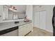 Stylish kitchen with white cabinets, granite countertops, stainless dishwasher, and an open layout at 5250 S Rainbow Blvd # 1144, Las Vegas, NV 89118