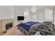 Spacious bedroom featuring carpeted floors, fireplace, and contemporary decor, perfect for relaxation at 5250 S Rainbow Blvd # 1144, Las Vegas, NV 89118