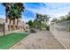Beautiful backyard has mature trees, gravel landscaping, and a turf area at 5541 Port Barrington Way, Las Vegas, NV 89130
