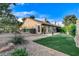 This backyard has mature trees, gravel landscaping, and a patio area at 5541 Port Barrington Way, Las Vegas, NV 89130