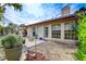 The backyard has a large patio, mature trees, and landscaping at 5541 Port Barrington Way, Las Vegas, NV 89130