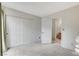 Bedroom with neutral walls, carpet, double closet, and attached bathroom at 5541 Port Barrington Way, Las Vegas, NV 89130