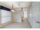Charming dining area with tile floors, a chandelier, and a large window with blinds at 5541 Port Barrington Way, Las Vegas, NV 89130