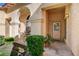 Charming front entrance with decorative columns, tiled porch, and a well-maintained garden at 5541 Port Barrington Way, Las Vegas, NV 89130
