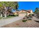 A single-story home with desert landscaping and a spacious driveway leading to a two-car garage at 5541 Port Barrington Way, Las Vegas, NV 89130