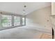 Bright living room featuring a fireplace and large windows at 5541 Port Barrington Way, Las Vegas, NV 89130