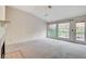 Cozy living room with fireplace, neutral carpet, and natural light at 5541 Port Barrington Way, Las Vegas, NV 89130