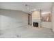 Open living room featuring a fireplace and bright light at 5541 Port Barrington Way, Las Vegas, NV 89130