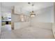 Spacious living room with neutral carpet and decorative chandelier at 5541 Port Barrington Way, Las Vegas, NV 89130