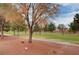 Picturesque walking path along the green space with mature trees providing shade and beauty at 5541 Port Barrington Way, Las Vegas, NV 89130