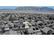 An elevated view of a home located in a neighborhood with scenic mountain backdrop at 5820 Amber Station Ave, Las Vegas, NV 89131