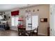 Cozy dining area featuring a round table, chandelier, and decorative movie-themed decor at 5820 Amber Station Ave, Las Vegas, NV 89131