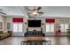 Bright, spacious living room with an entertainment center and movie-themed decor at 5820 Amber Station Ave, Las Vegas, NV 89131