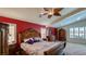 Comfortable main bedroom with vaulted ceilings, ceiling fan, and coordinating furniture at 5820 Amber Station Ave, Las Vegas, NV 89131