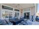 Outdoor patio space with dining table, overhead string lights and ample seating at 5820 Amber Station Ave, Las Vegas, NV 89131