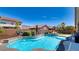 Backyard oasis showcasing a private pool and spa surrounded by lush landscaping at 5820 Amber Station Ave, Las Vegas, NV 89131