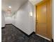 Well-maintained hallway with modern carpeting leading to a suite entrance at 59 E Agate Ave # 306, Las Vegas, NV 89123