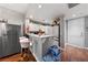 Modern kitchen with stainless steel appliances and breakfast bar at 59 E Agate Ave # 306, Las Vegas, NV 89123