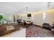 Spacious lounge featuring a large table, comfortable seating, and a TV at 59 E Agate Ave # 306, Las Vegas, NV 89123