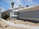 Well-maintained one-story home with desert landscaping, sidewalk and some greenery at 5912 Wabusca Way, Las Vegas, NV 89142