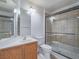 Well-lit bathroom offers shower and bath combo, vanity, and neutral paint at 5929 Sleepy Fawn Dr, Las Vegas, NV 89142
