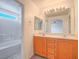 En-suite bathroom boasts dual sinks, a tub-shower combo, and natural lighting at 5929 Sleepy Fawn Dr, Las Vegas, NV 89142