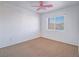 Bright bedroom features neutral carpet, white walls, and a window offering natural light at 5929 Sleepy Fawn Dr, Las Vegas, NV 89142